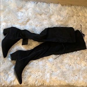 Black knee high heeled suede boots